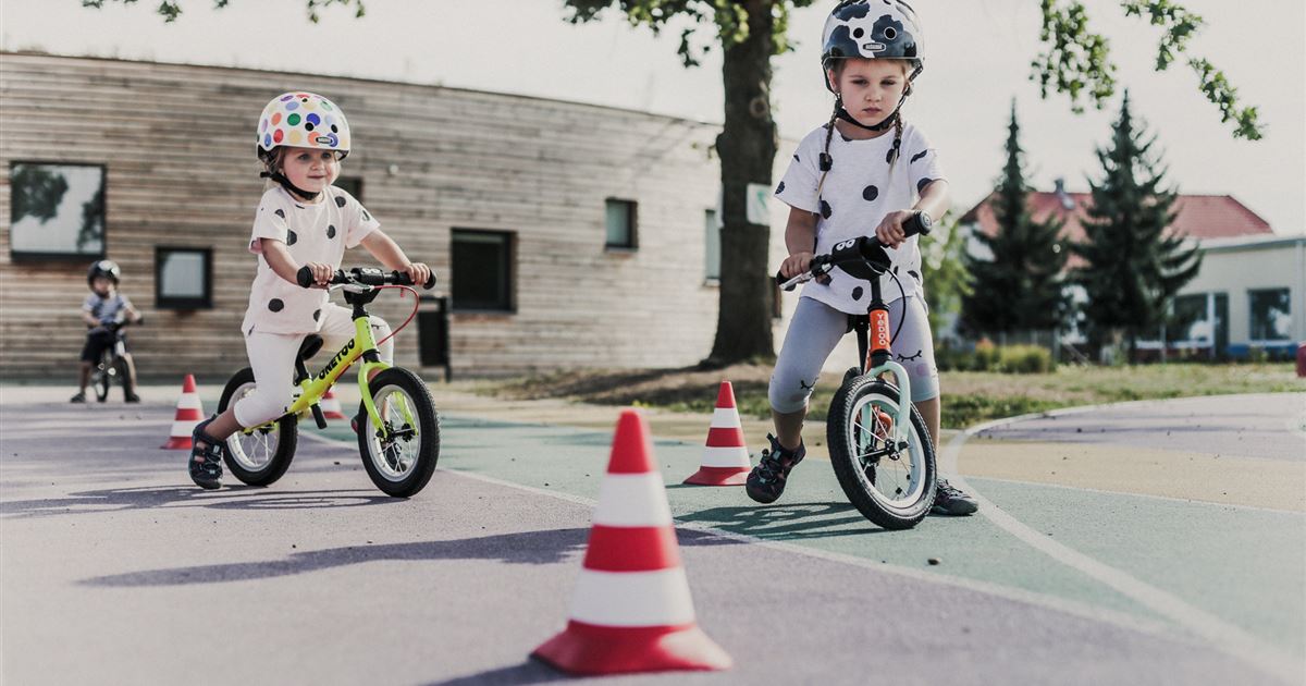 child on balance bike