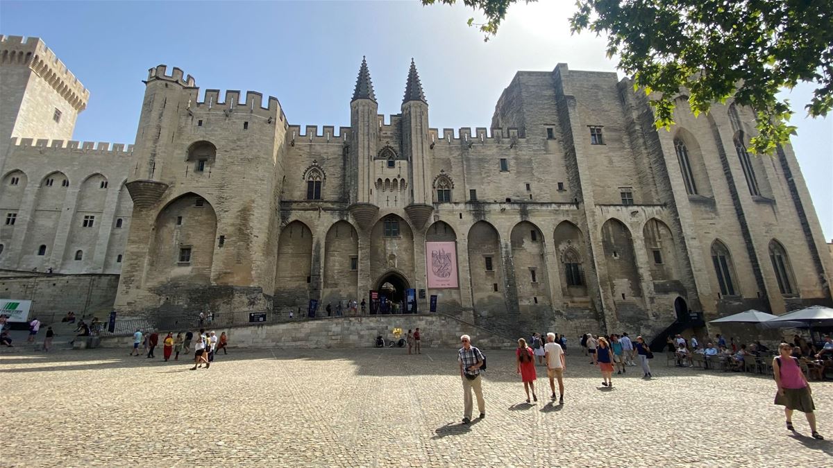 Josef usually avoided big cities, but he did not miss the chance to visit the Palace of the Popes in Avignon. 